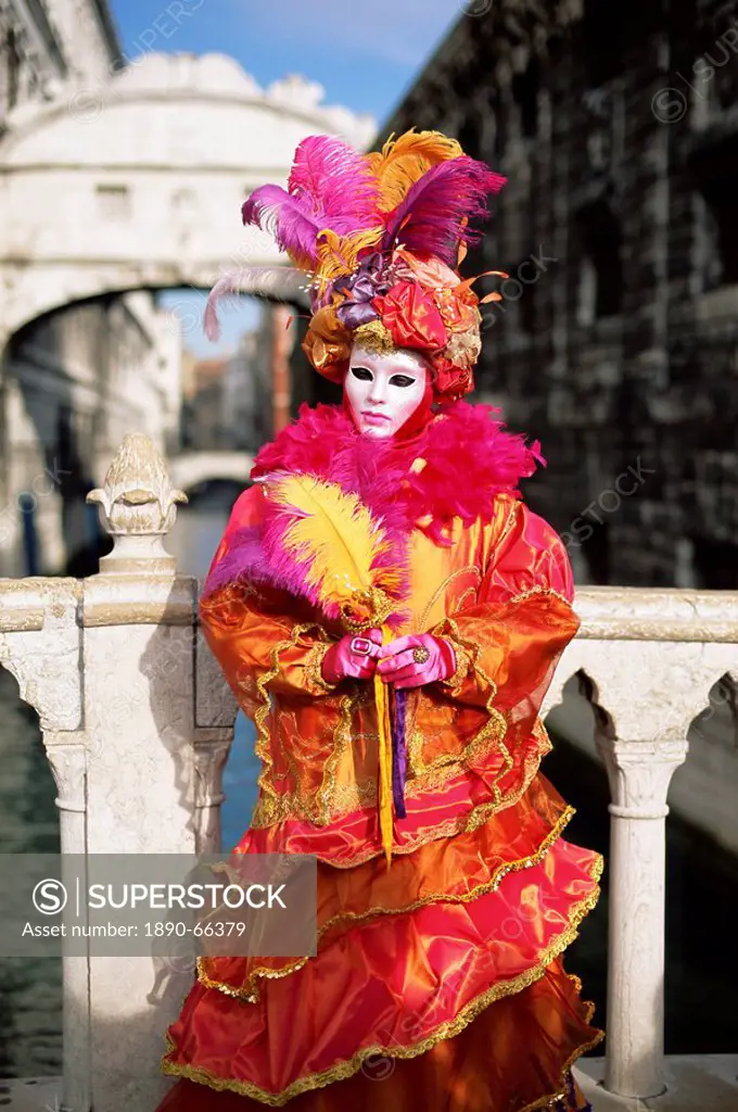 Person dressed in carnival mask and costume, posing in front of the Bridge of Sighs, Venice Carnival, Venice, Veneto, Italy, Europe