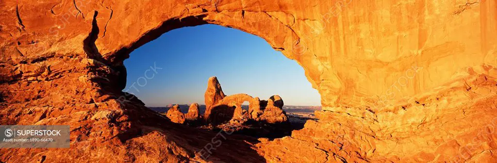 Turret Arch through North Window at sunrise, Arches National Park, Moab, Utah, United States of America U.S.A., North America