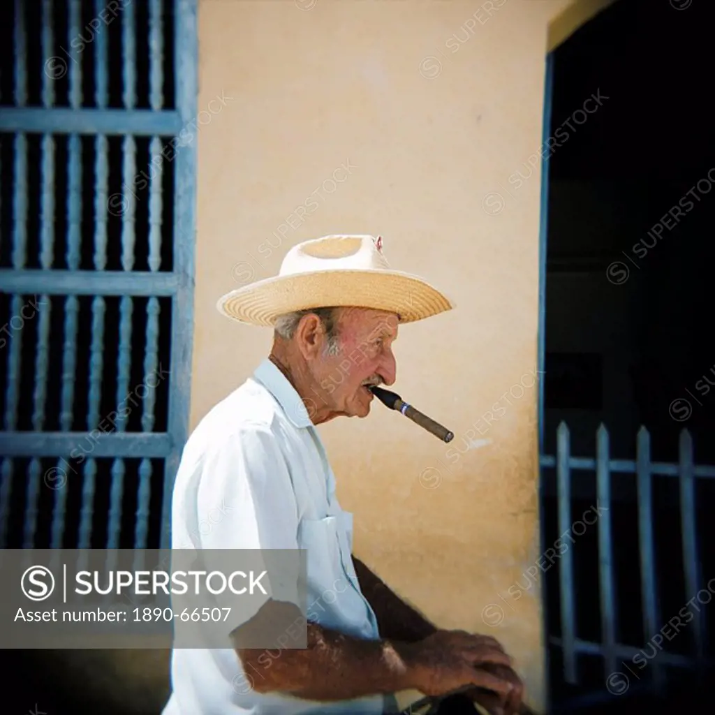 Old man in profile, smoking cigar, Trinidad, Cuba, West Indies, Central America
