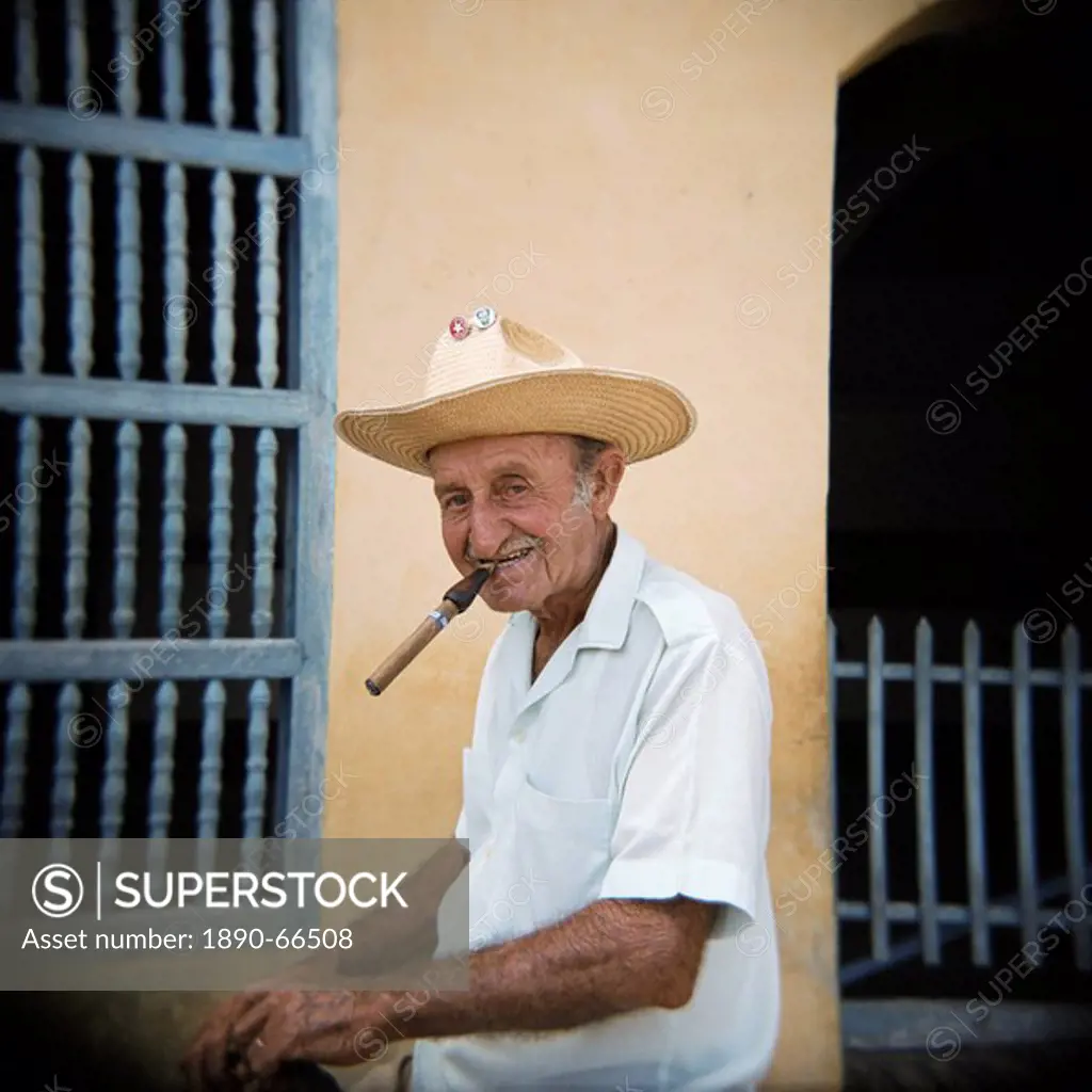 Old man smoking cigar, Trinidad, Cuba, West Indies, Central America
