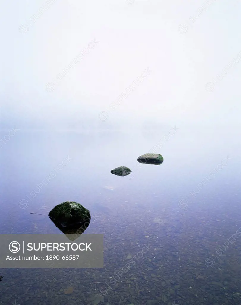 Three stones on the edge of Grasmere, Lake District National Park, Cumbria, England, United Kingdom, Europe