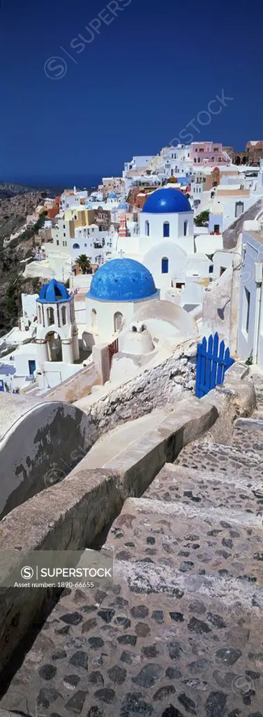Village of Oia with blue_domed churches and whitewashed buildings, Santorini, Cyclades, Greek Islands, Greece, Europe