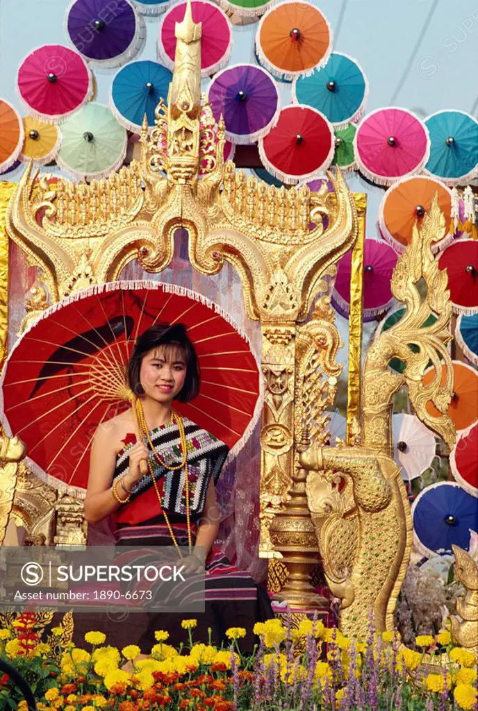 Portrait of a woman with umbrella seated on a golden throne in a parade in Chiang Mai, Thailand, Southeast Asia, Asia
