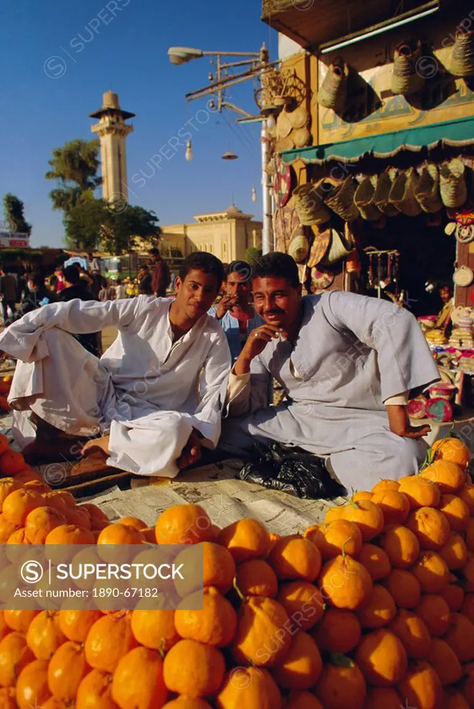 Market traders by their orange stall, Luxor, Egypt, North Africa