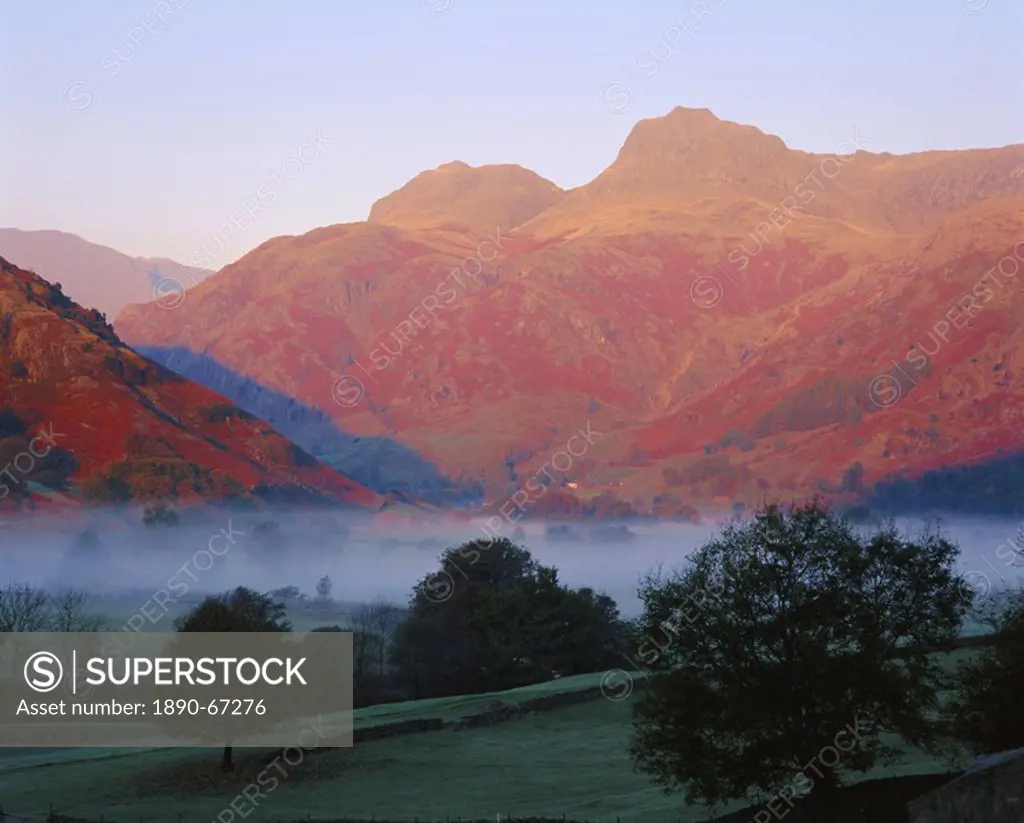 Morning mist, Great Langdale from Chapel Stile, Langdale Pikes in early morning light, Lake District National Park, Cumbria, England, UK