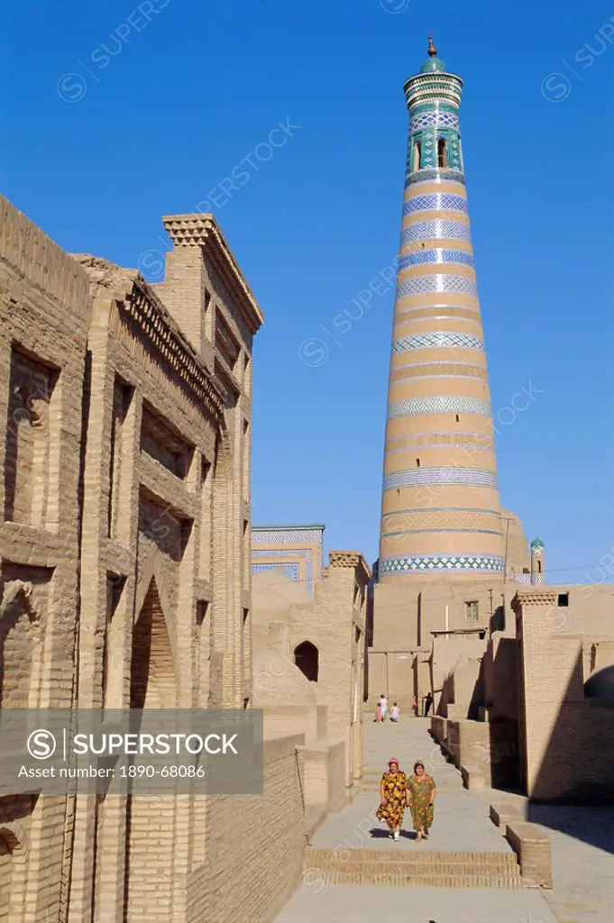 Islam Khodja minaret, Prince Makhmud mausoleum on left, Khiva, Uzbekistan, Central Asia