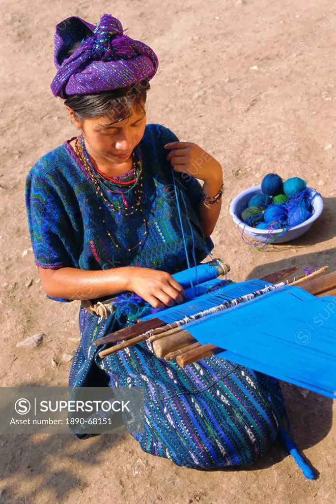Girl weaving traditional huipil, Santa Caterina Papopo, Guatemala, Central America