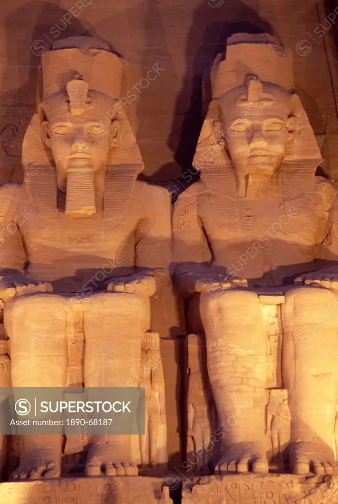 Floodlit colossi of Ramses II Ramesses the Great, seated statues on facade of temple, Abu Simbel, UNESCO World Heritage Site, Nubia, Egypt, North Afri...