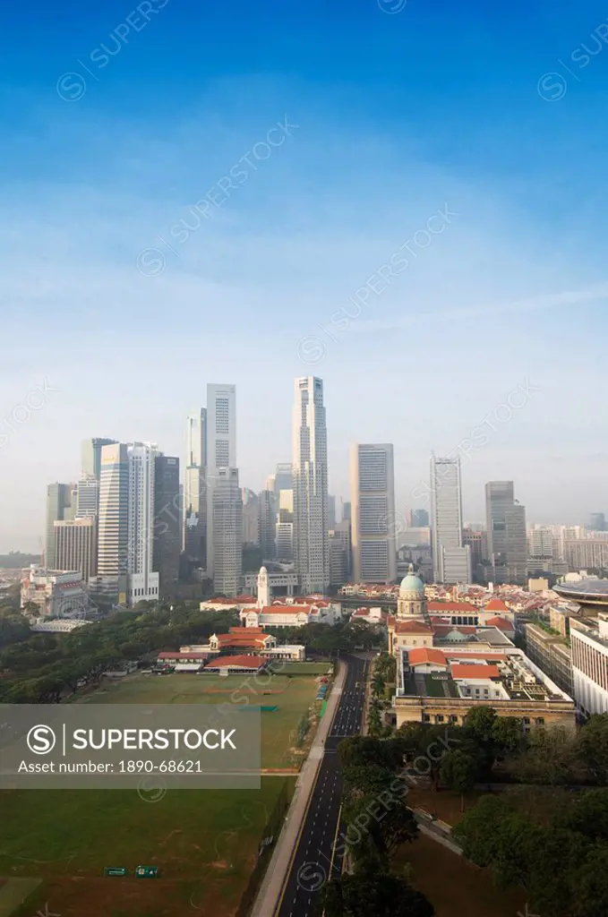 Singapore city skyline at dawn with the Padang and Colonial District in the foreground, Singapore, Southeast Asia, Asia