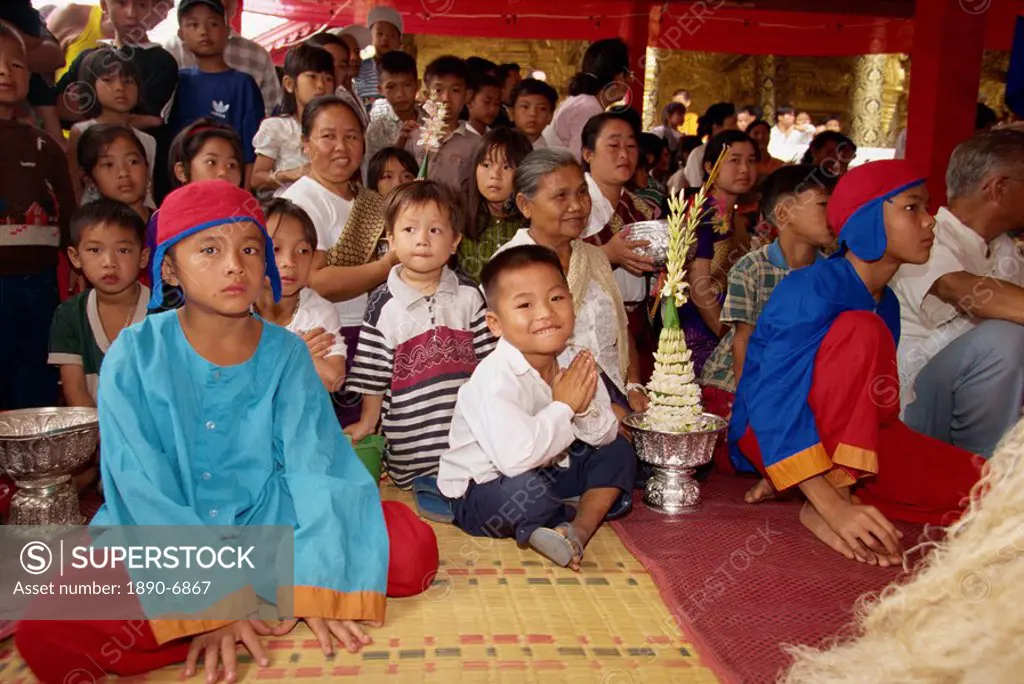 Celebrations of Pimai, the Lao New Year, involving ancestors from mythology, with people in Wat Mai in Luang Prabang, Laos, Indochina, Southeast Asia,...