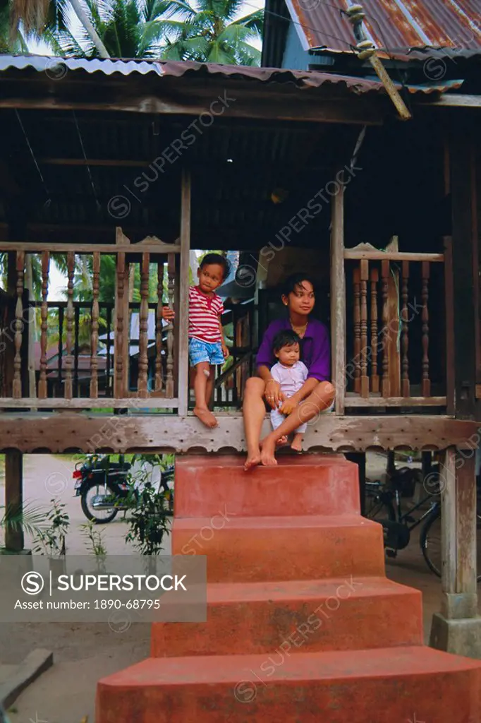 Stilt house and local family in traditional Malayan village, Penang, Malaysia