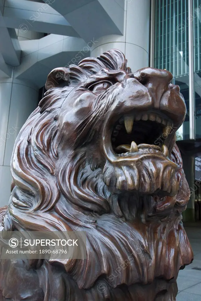 Bronze lion statue outside the HSBC Bank Headquarters, rubbing its paws is said to bring good luck, Central, Hong Kong, China, Asia