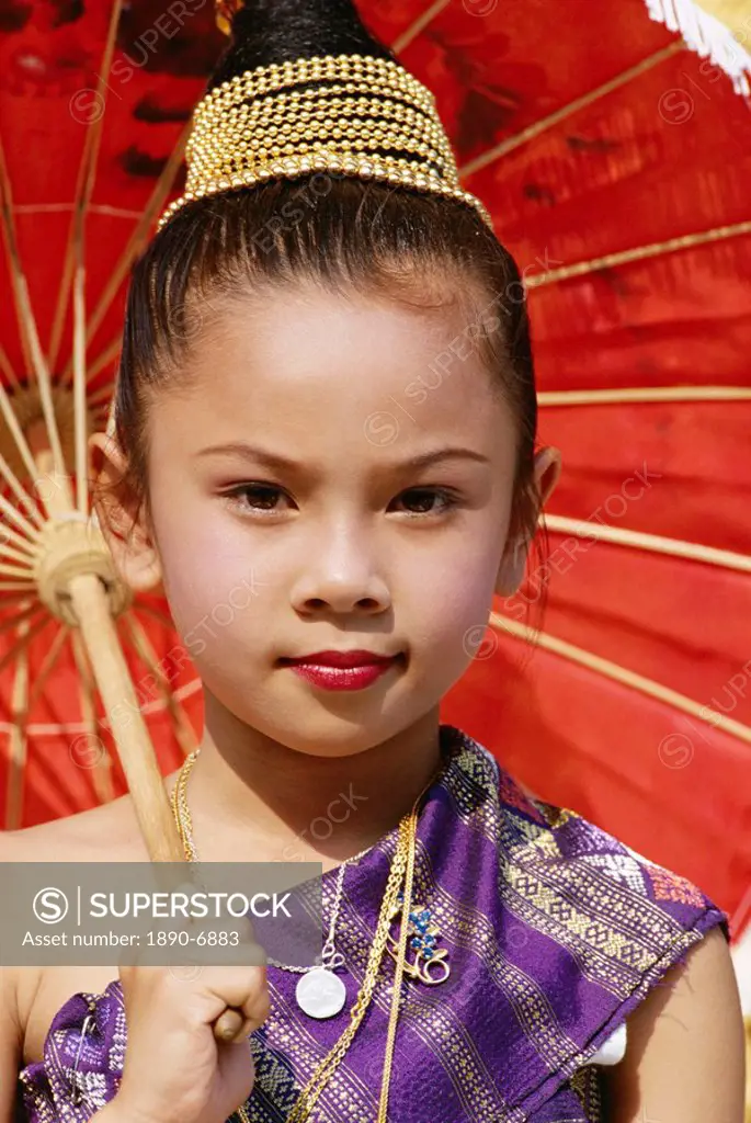 Young Laotian girl in traditional dress holding a red parasol, Laos, Indochina, Southeast Asia, Asia