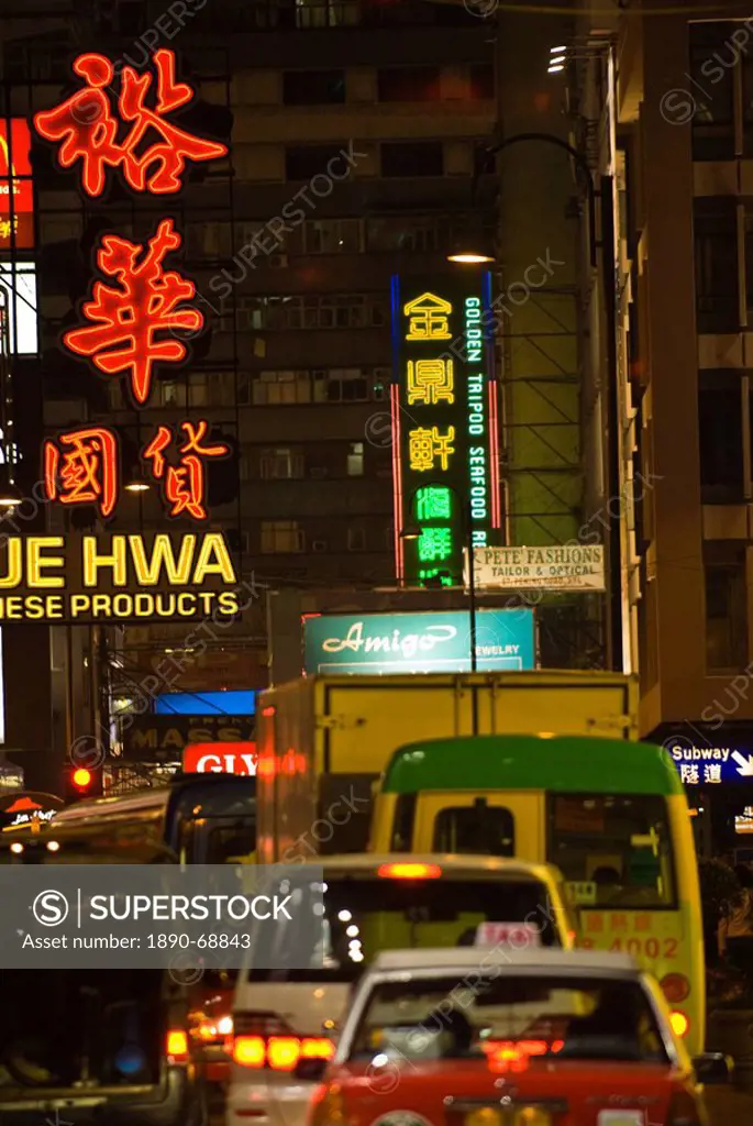 Busy street in Kowloon at night, Hong Kong, China, Asia