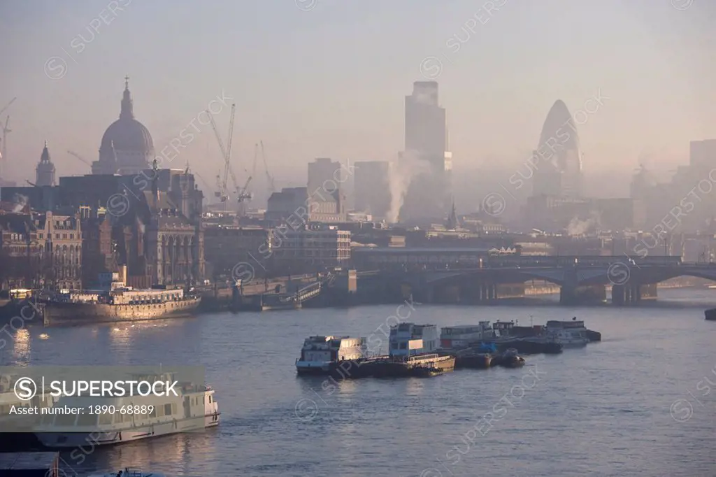 Early morning fog over the City of London skyline, London, England, United Kingdom, Europe