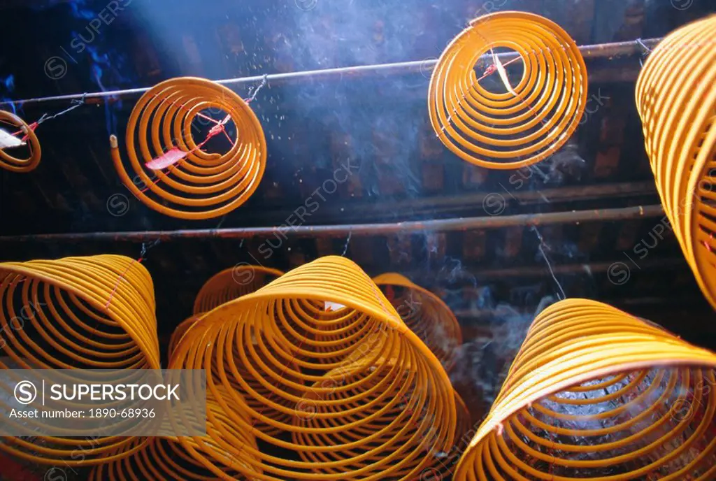 Burning incense at Kuanyin Temple, Ma Hang Village, Stanley Bay, Hong Kong Island, Hong Kong, China