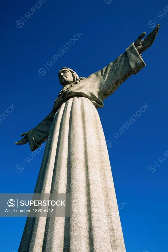 Statue of Christo Rei, 28m high, built in 1959, located in the Cacilhas suburb across the River Tejo, in Lisbon, Portugal, Europe