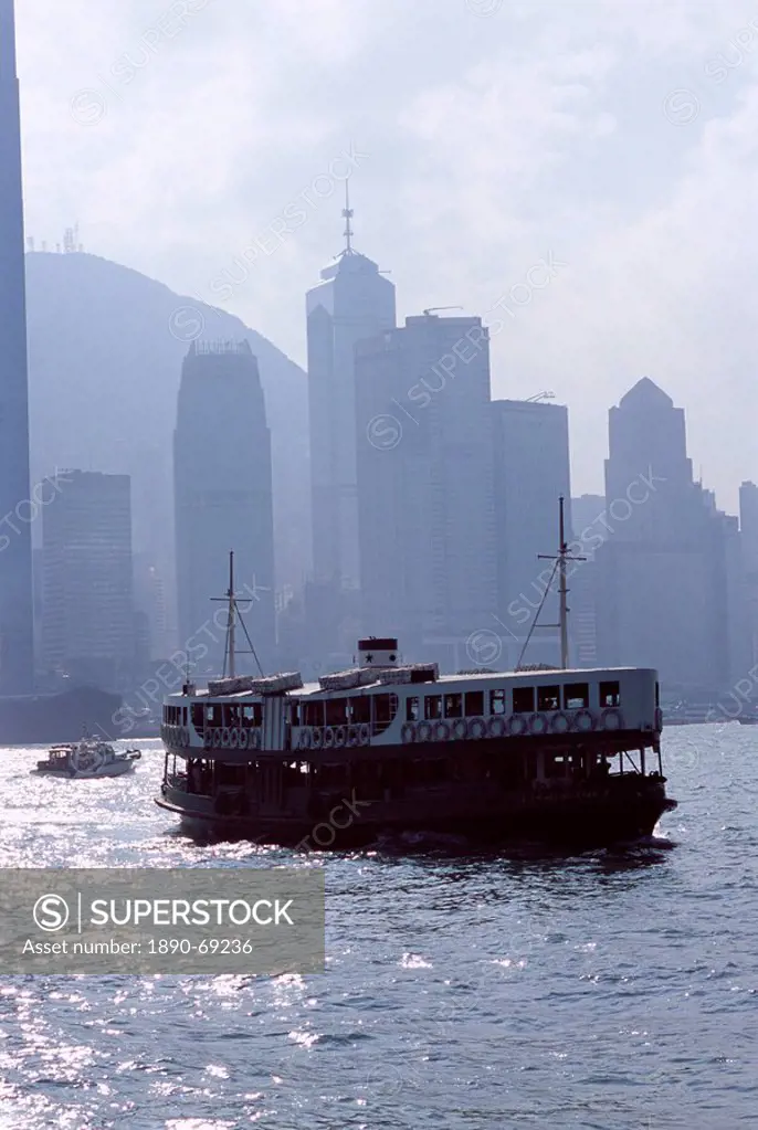 Star Ferry, Victoria Harbour, with Hong Kong Island skyline in mist beyond, Hong Kong, China, Asia