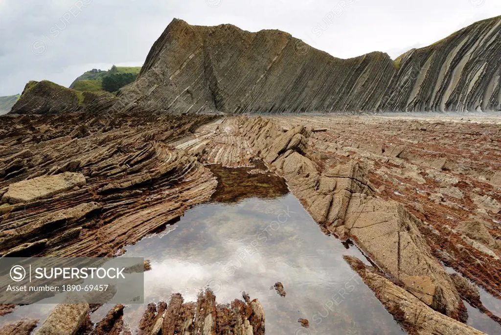 Rock formations flysch at low tide on coast between Zumaia and Deba, Costa Vasca, Basque country, Euskadi, Spain, Europe