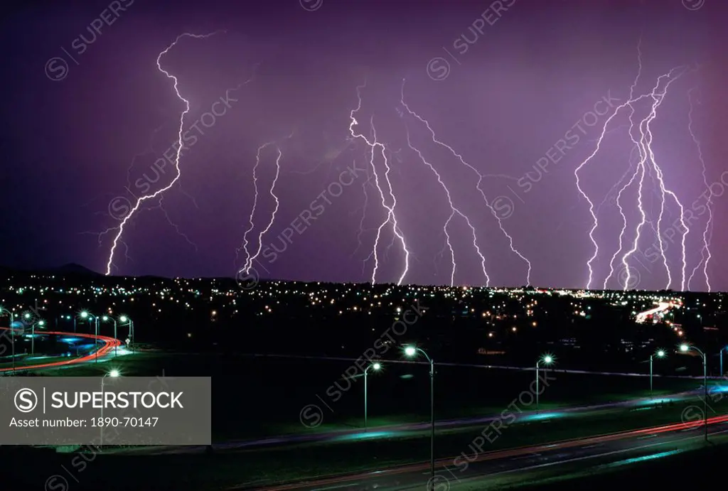Fork lightning at night over a city