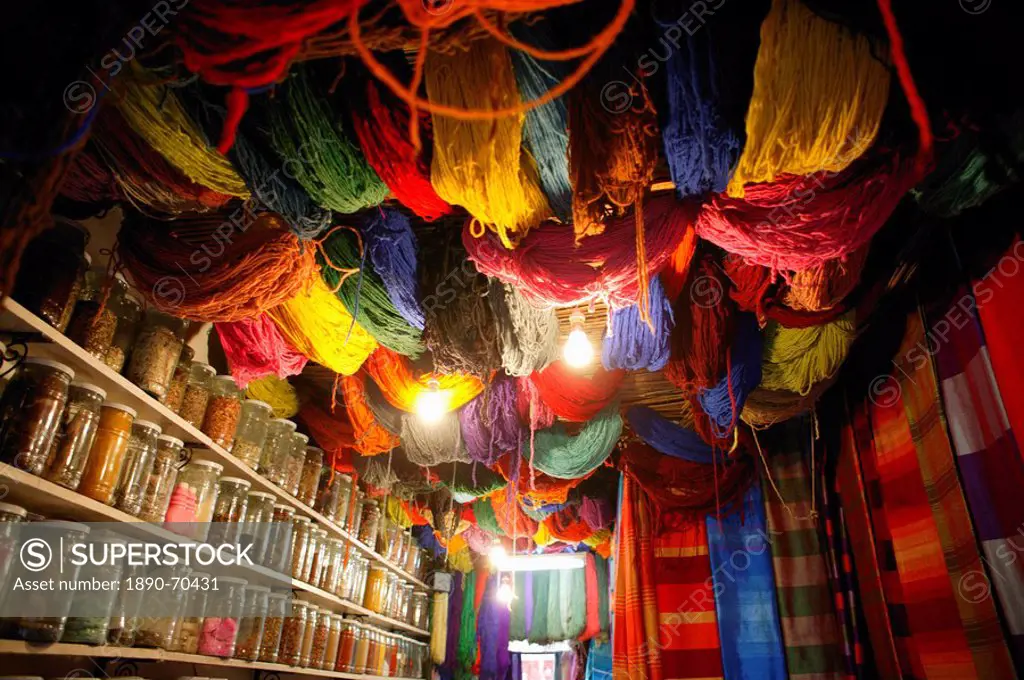 Brightly dyed wool hanging from roof of a shop, Marrakech, Morrocco, North Africa, Africa
