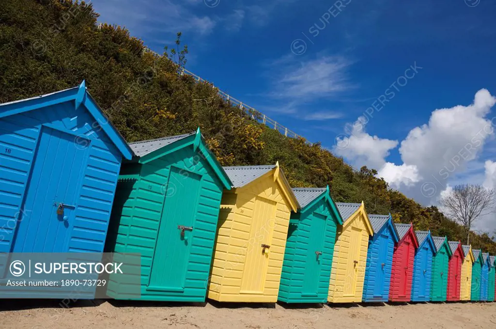 Multicoloured beach huts on the long sweeping beach of Llanbedrog, Llyn Peninsula, Gwynedd, North Wales, Wales, United Kingdom, Europe