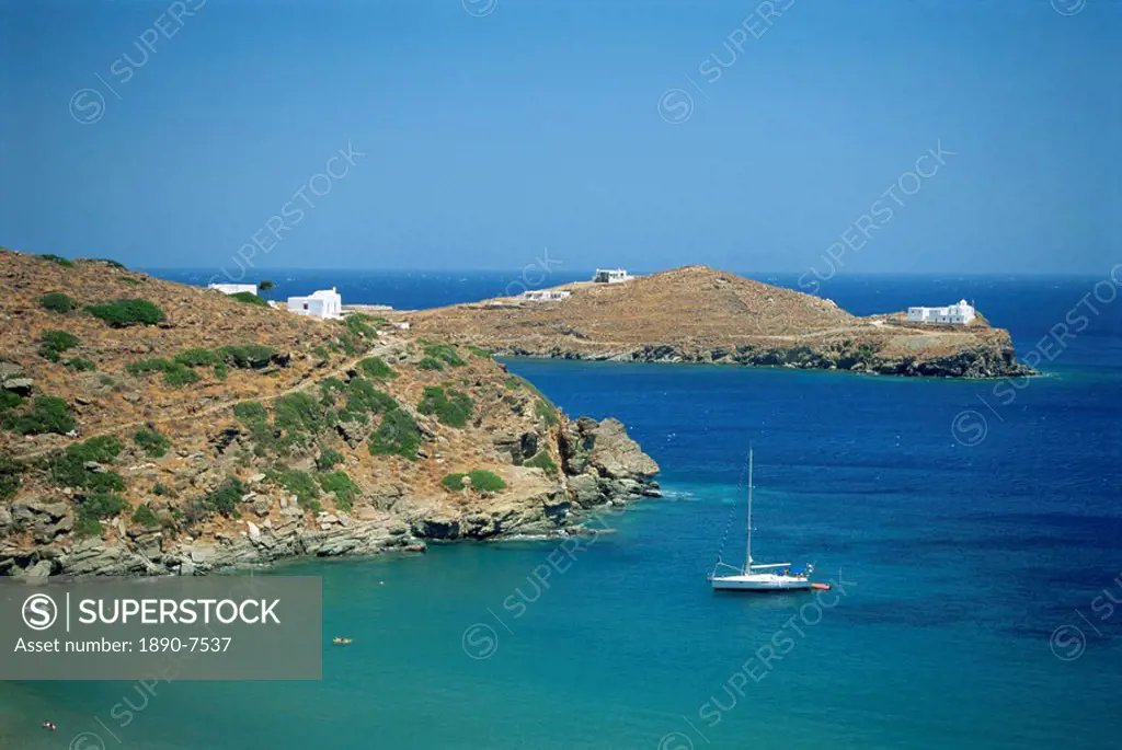 Boat and coastline of the Bay of Apokofto on Sifnos, Cyclades Islands, Greek Islands, Greece, Europe