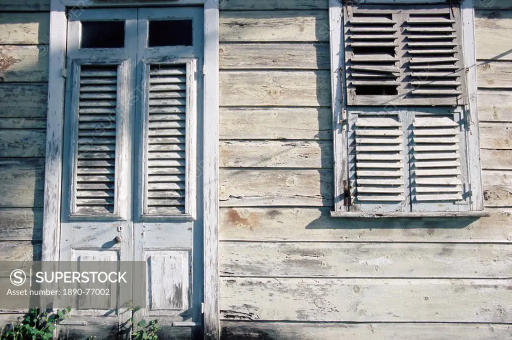 Broken shutters on door and window on wooden house, Barbados, West Indies, Caribbean, Central America