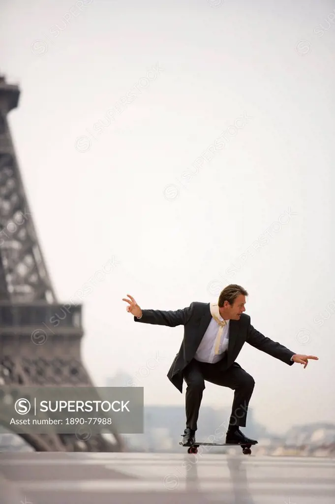 Man on skateboard, Eiffel Tower, Paris, France, Europe