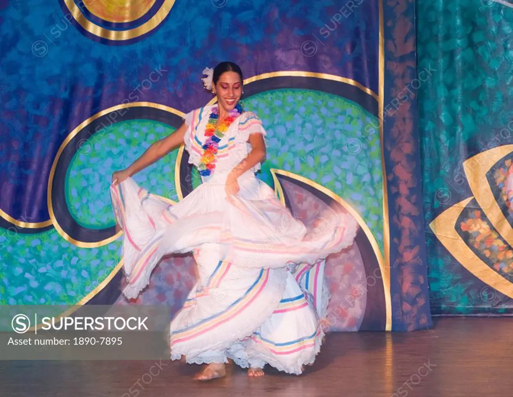 A flamenco dancer in colourful costume performing during the evening entertainment at the Melia Rio de Oro Hotel, Playa Esmeralda, Guardalavaca, Cuba,...