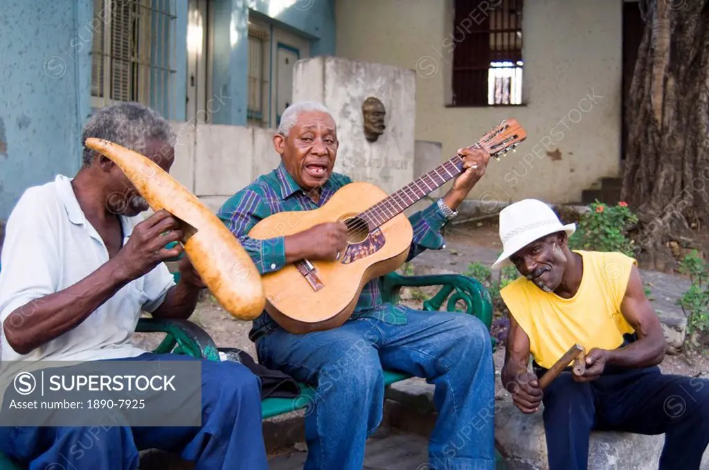 Musicians playing on the street in Santiago de Cuba, Cuba, West Indies, Central America