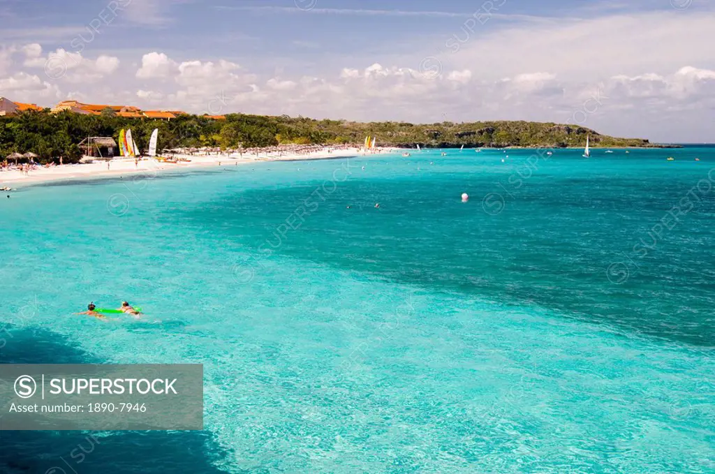 Swimmers in aqua seas, Playa Esmeralda, Carretera Guardalavarca, Cuba, West Indies, Central America