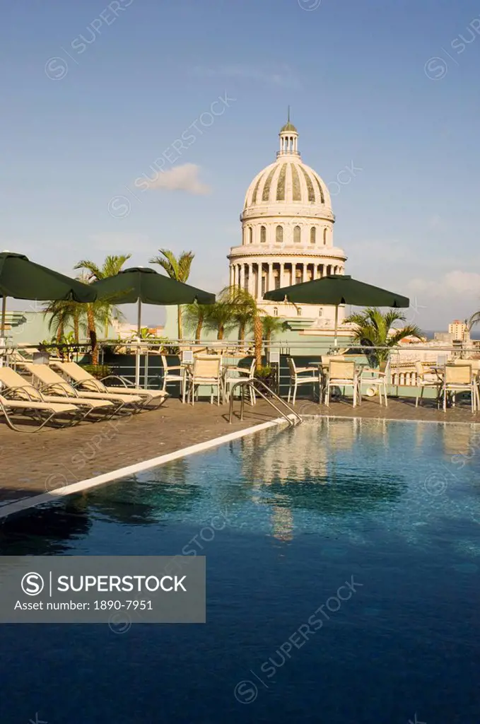 A swimming pool on the roof terrace of the Hotel Saratoga overlooking the Capitolio in central Havana, Cuba, West Indies, Central America
