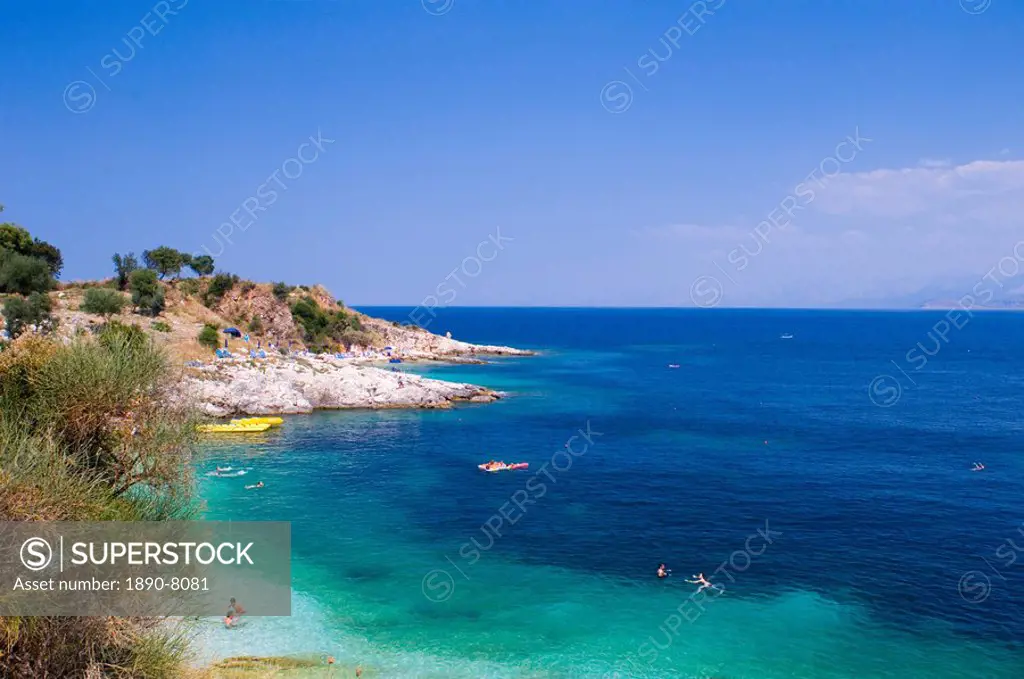 Swimmers in the sea near Kassiopi, northeast coast, Corfu, Ionian Islands, Greek Islands, Greece, Europe