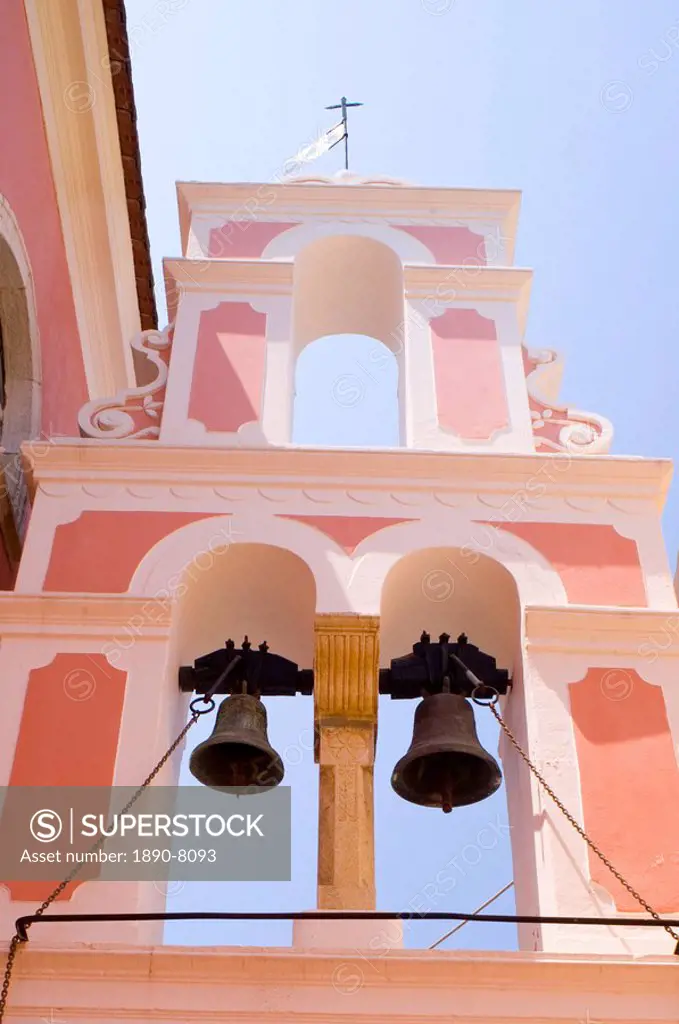 The pink and white belltower of Agios Triada in Gaios, Paxos, Ionian Islands, Greek Islands, Greece, Europe