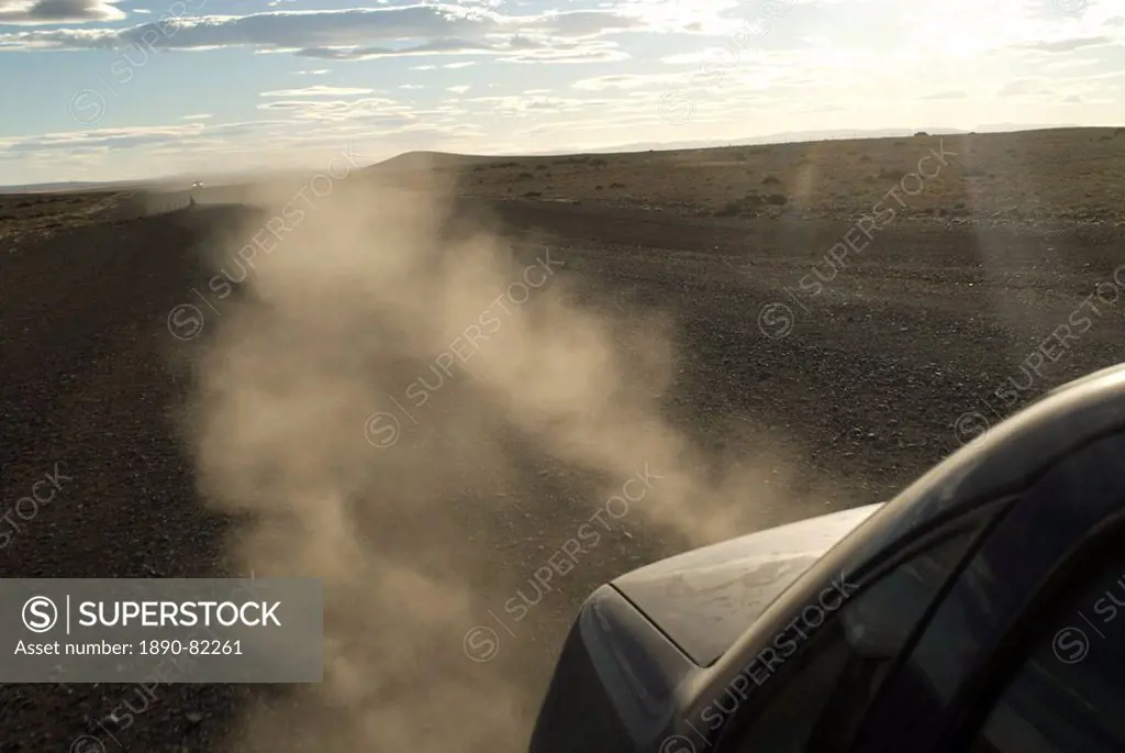 Dust kicks up from behind of car in Patagonia, on the infamous Route 40, Southern Argentina, South America
