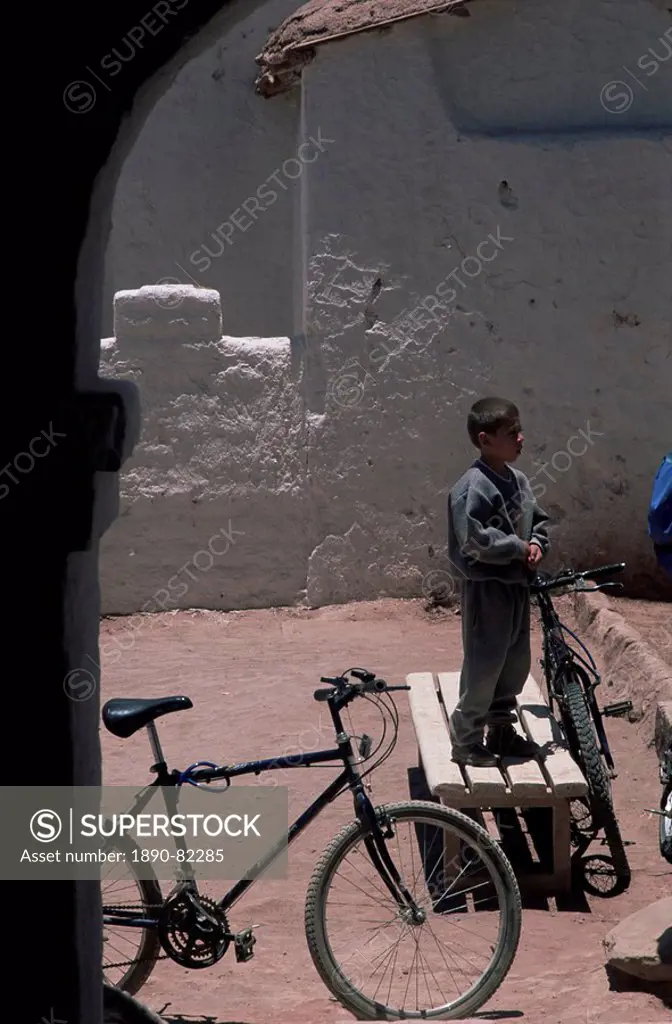 Boy and bike, San Pedro de Atacama, Chile, South America