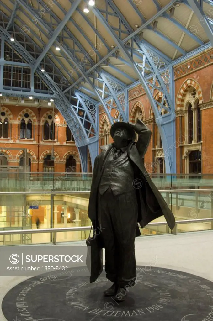 A statue of the writer and saver of St. Pancras Station, Sir John Betjeman, in newly renovated station, London, England, United Kingdom, Europe