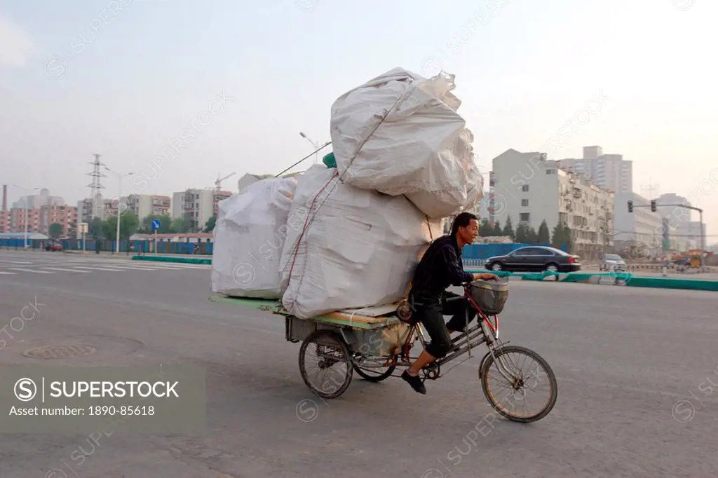 Transporting a precarious load through Beijing, China, Asia