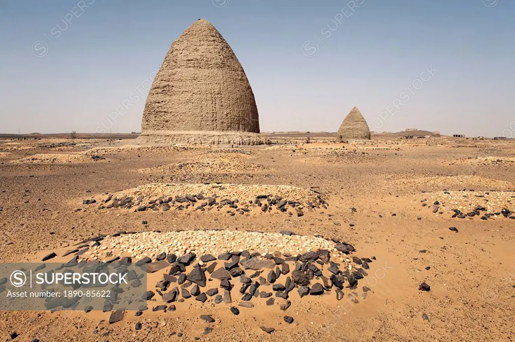 Graves, including beehive graves Tholos tombs, in the desert near the ruins of the medieval city of Old Dongola, Sudan, Africa