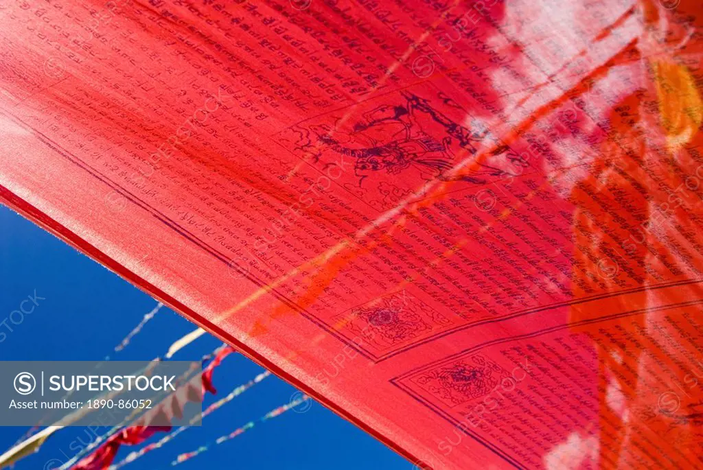 Red prayer flags against blue sky, Yushu, Qinghai, China, Asia