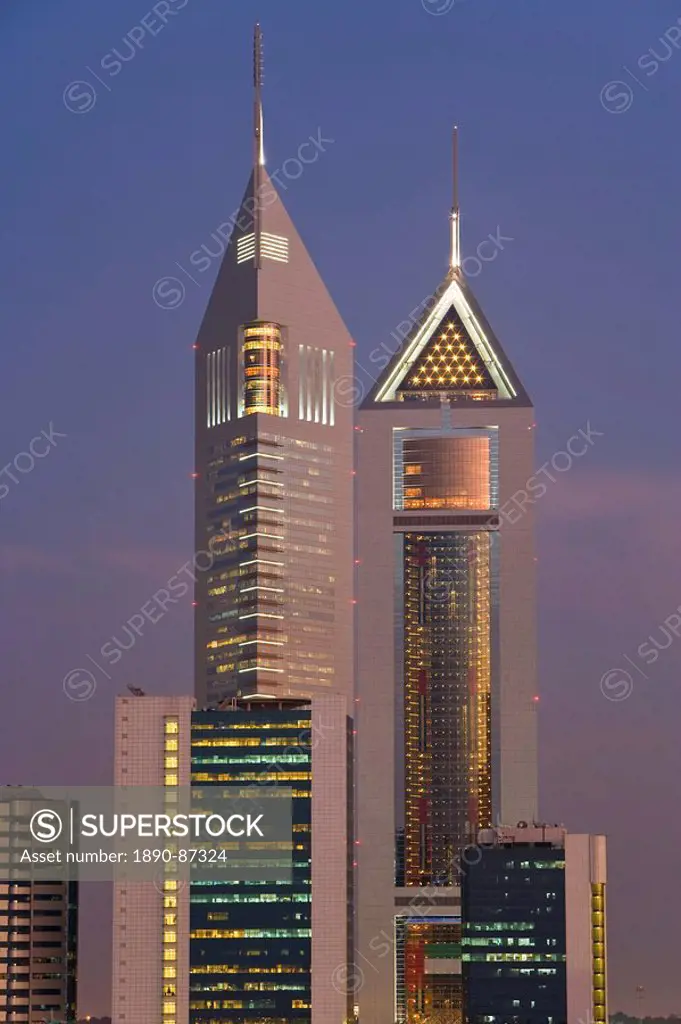 Emirates Towers on Sheikh Zayed Road illuminated at dusk, Dubai, United Arab Emirates, Middle East