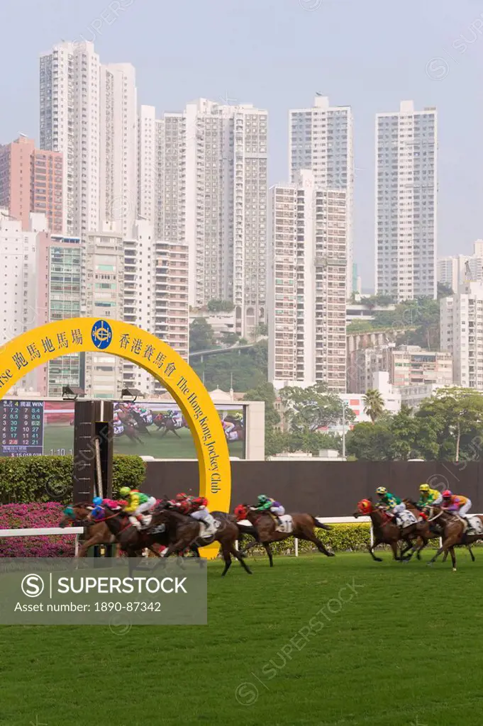 Horses racing at Happy Valley racecourse, Hong Kong, China, Asia