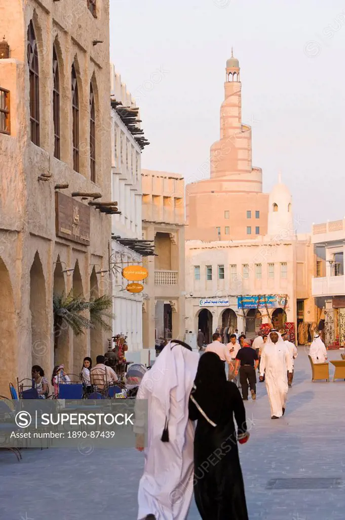The restored Souq Waqif looking towards the spiral mosque of the Kassem Darwish Fakhroo Islamic Centre based on the Great Mosque in Samarra in Iraq, D...