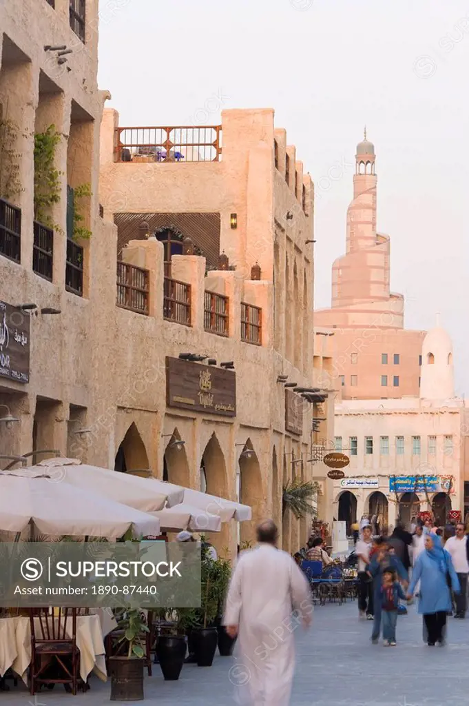 The restored Souq Waqif looking towards the spiral mosque of the Kassem Darwish Fakhroo Islamic Centre based on the Great Mosque in Samarr in Iraq, Do...