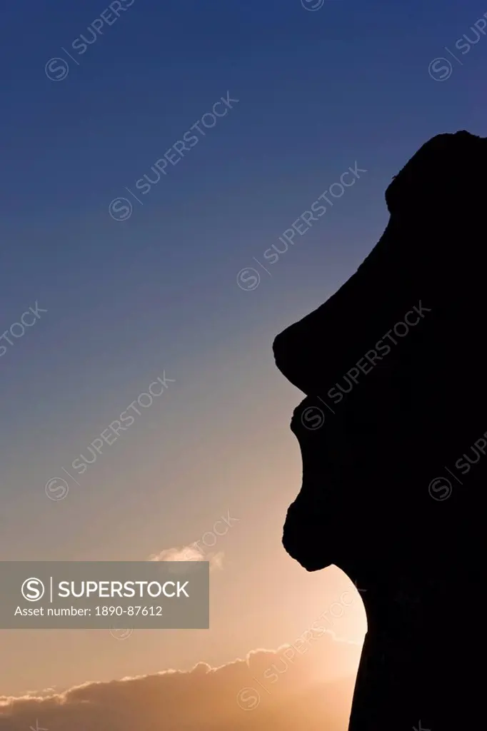 Silhouette of a lone monolithic giant stone Moai statue at Tongariki, Rapa Nui Easter Island, UNESCO World Heritage Site, Chile, South America