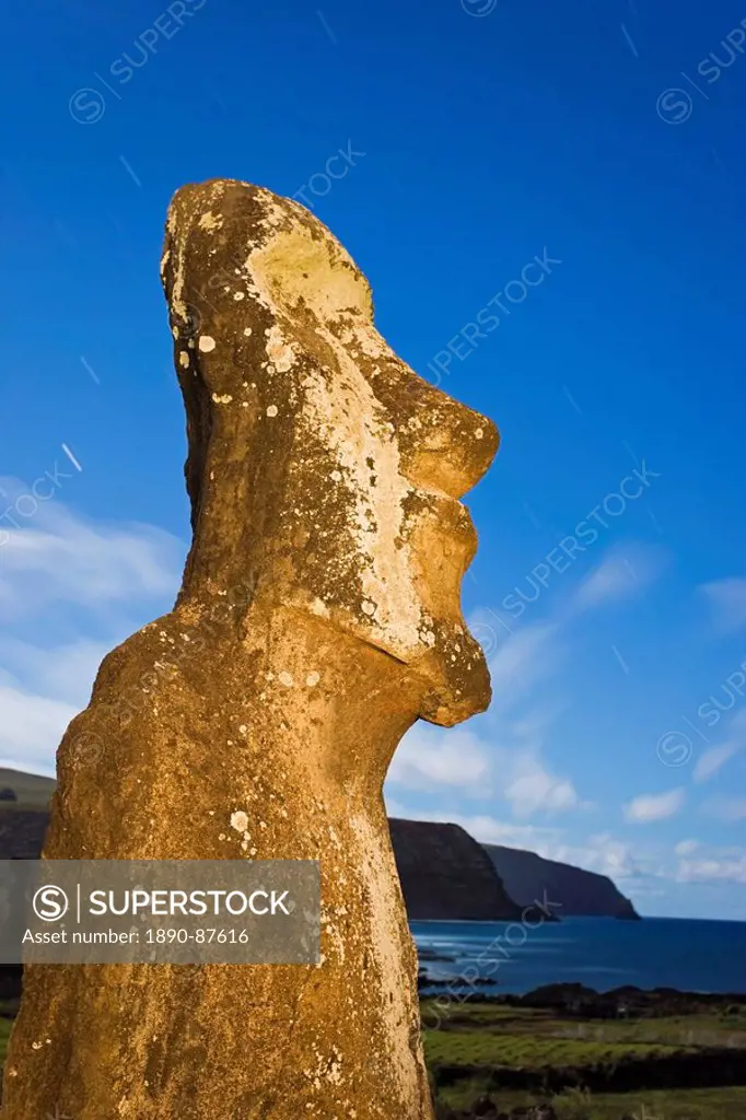 Lone monolithic giant stone Moai statue looking out to sea at Tongariki, Rapa Nui Easter Island, UNESCO World Heritage Site, Chile, South America