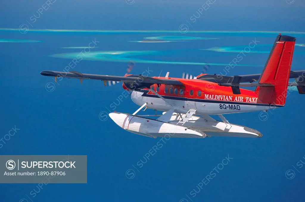 Aerial view of Maldivian air taxi flying in the Maldives archipelago, Indian Ocean, Asia