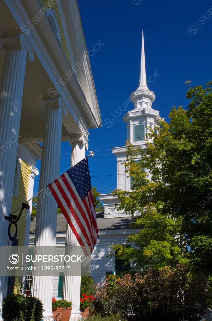 An American flag and the Presbyterian Church in Rensselaerville, New York State, United States of America, North America