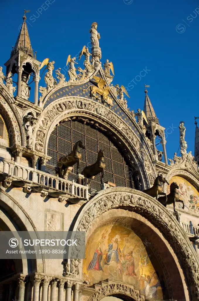 A close_up of the facade of the Basilica San Marco in St. Mark´s Square showing statues called the Horses of St. Mark, Venice, UNESCO World Heritage S...